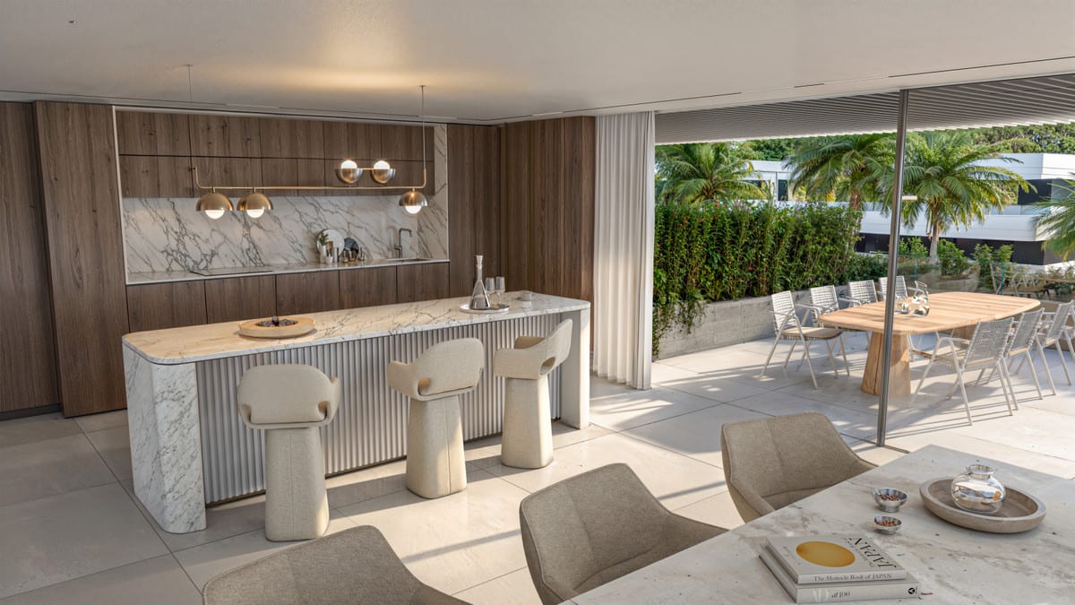 Rendered kitchen at THE PRIVILEGE with an island and three bar stools, an indoor dining table and a wooden dining table on the adjoining terrace.