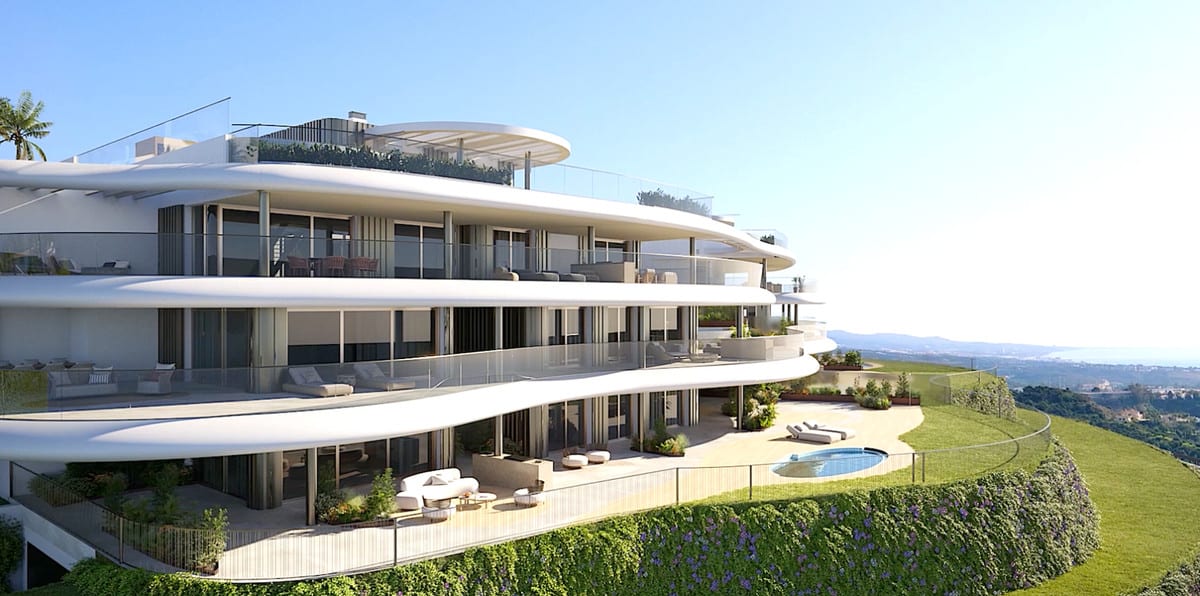 Project visualisation — THE SKY MARBELLA APARTMENTS: Residential building with curved balconies and garden terraces.