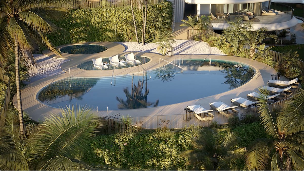 Project visualisation — THE SKY MARBELLA APARTMENTS: Pool area with loungers and tropical planting, viewed from above.