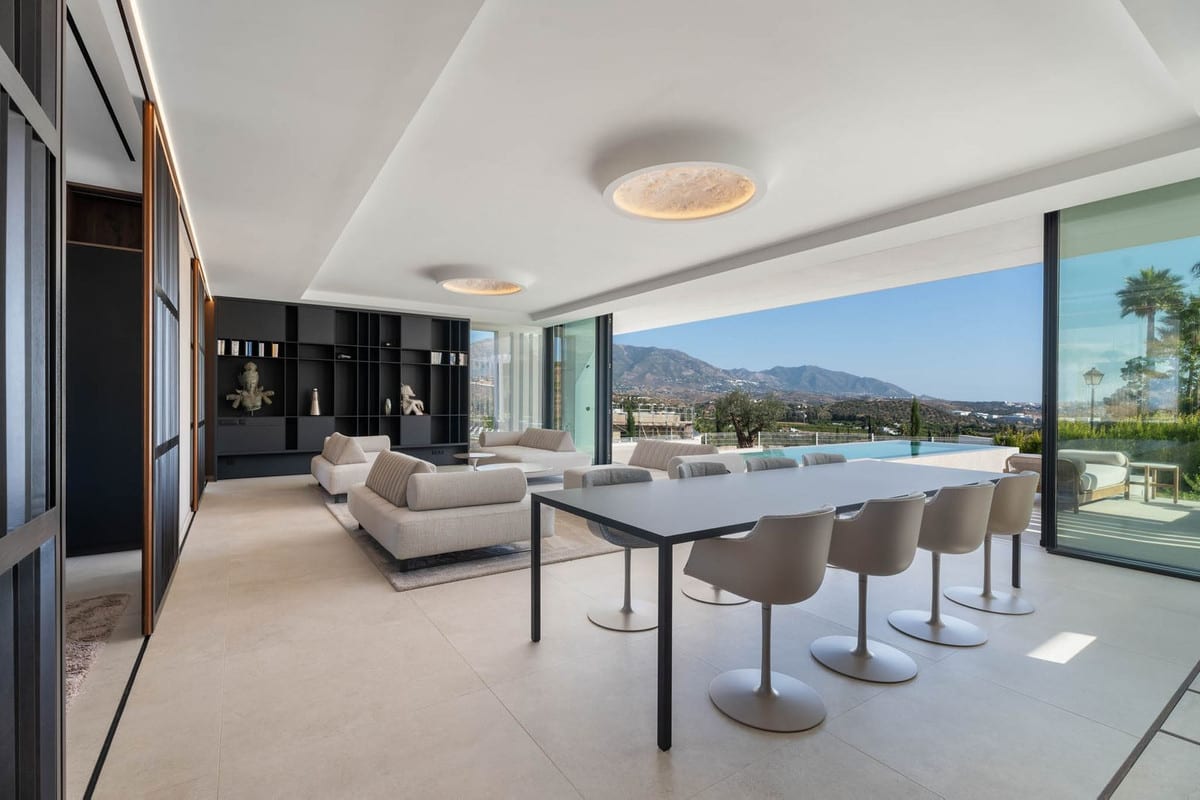 Visualisation of an open living and dining area with sliding doors to the pool terrace.