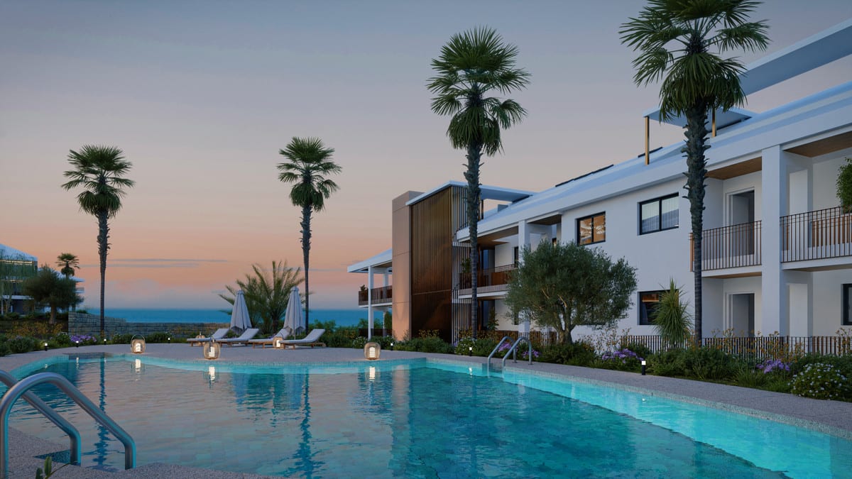 Project visualisation of UNIQUE INFINITY with an illuminated swimming pool featuring lanterns, palm trees, sun loungers, ground lights and white façades at dusk.