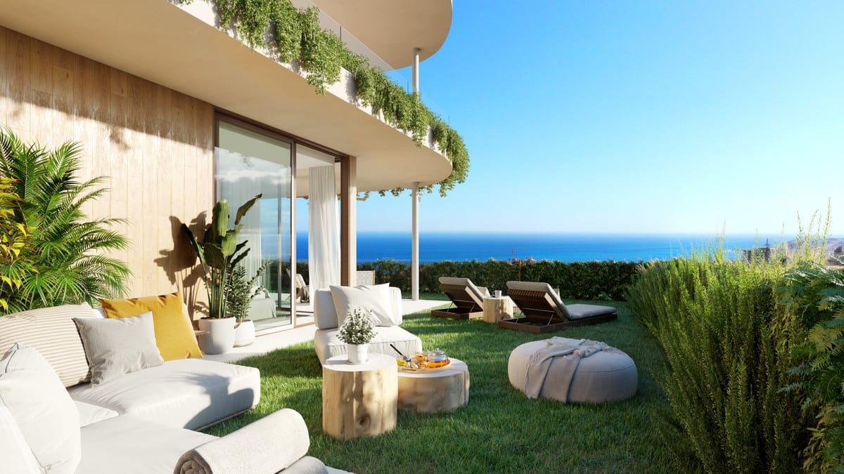 Project visualisation of VALLEY COLLECTION featuring a lounge seating area, wooden coffee tables, sun loungers on a lawn, large glass sliding doors, and the sea in the background.