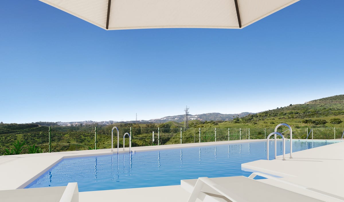 Project visualisation of VALLEY VIEWS featuring an outdoor swimming pool, white sun loungers, metal stair handrails, a parasol and green hills in the background.