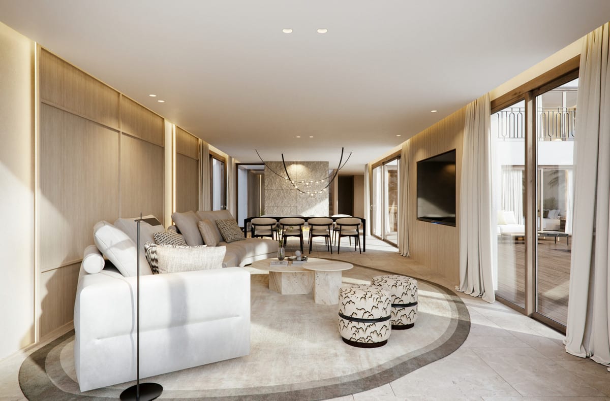 View through the living room towards the dining area, with sliding doors to the terrace.