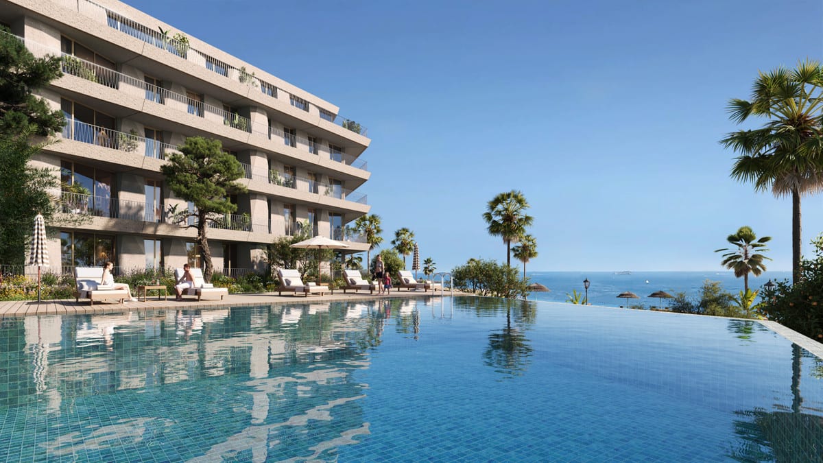 Rendered visualisation of VESTA MARE with a large outdoor swimming pool in the foreground, sun loungers with parasols, palm trees and a multi-storey building with balconies on the left.