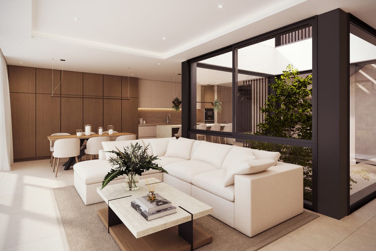 Project visualisation — VILLA AINOA: Living room with a white sofa facing the glazed courtyard.