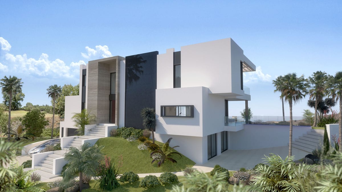 Side view of the villa with a garden, driveway and tall windows.
