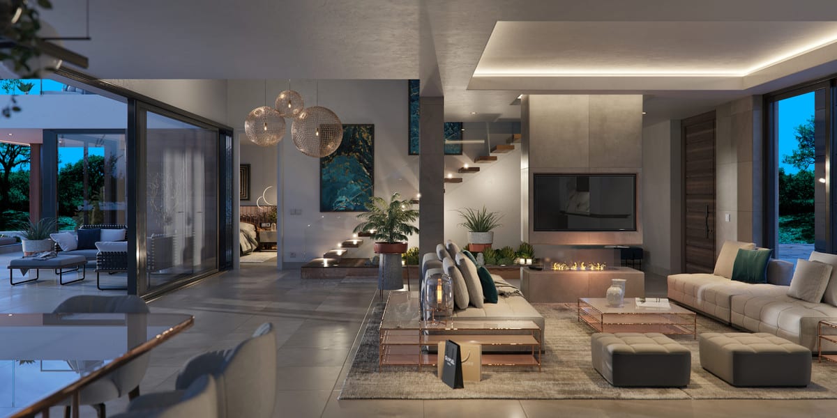 Evening rendering of the living space with soft lighting, a fireplace and sliding doors open to the terrace.