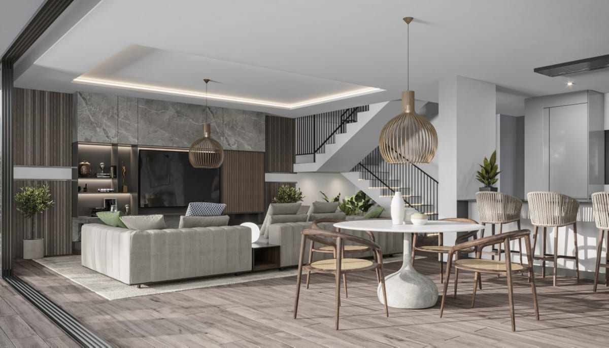 Visualisation of an open living and dining area with a round table, kitchen counter and staircase.