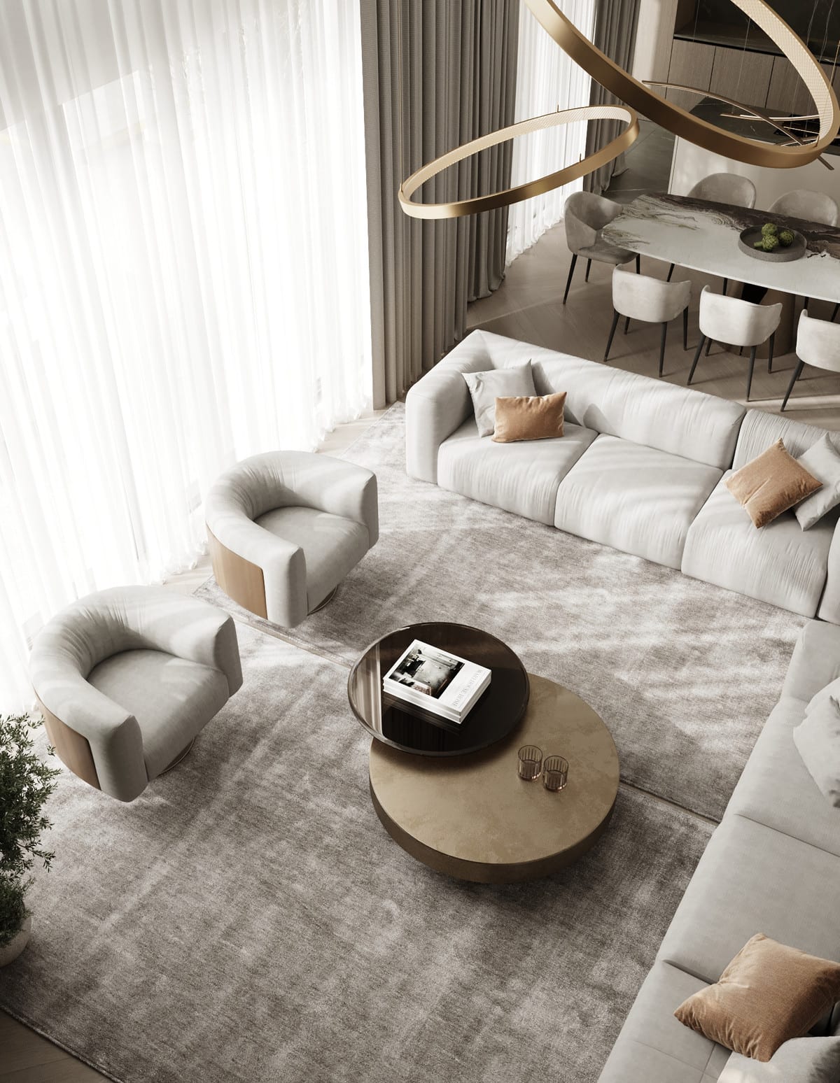 Elevated interior view of VILLA IVORY with a sofa, armchairs, round coffee tables, tall curtains and a visible dining area.