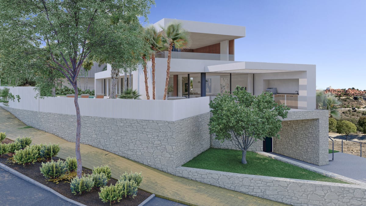 Exterior corner view of the villa with covered terraces and retaining walls.