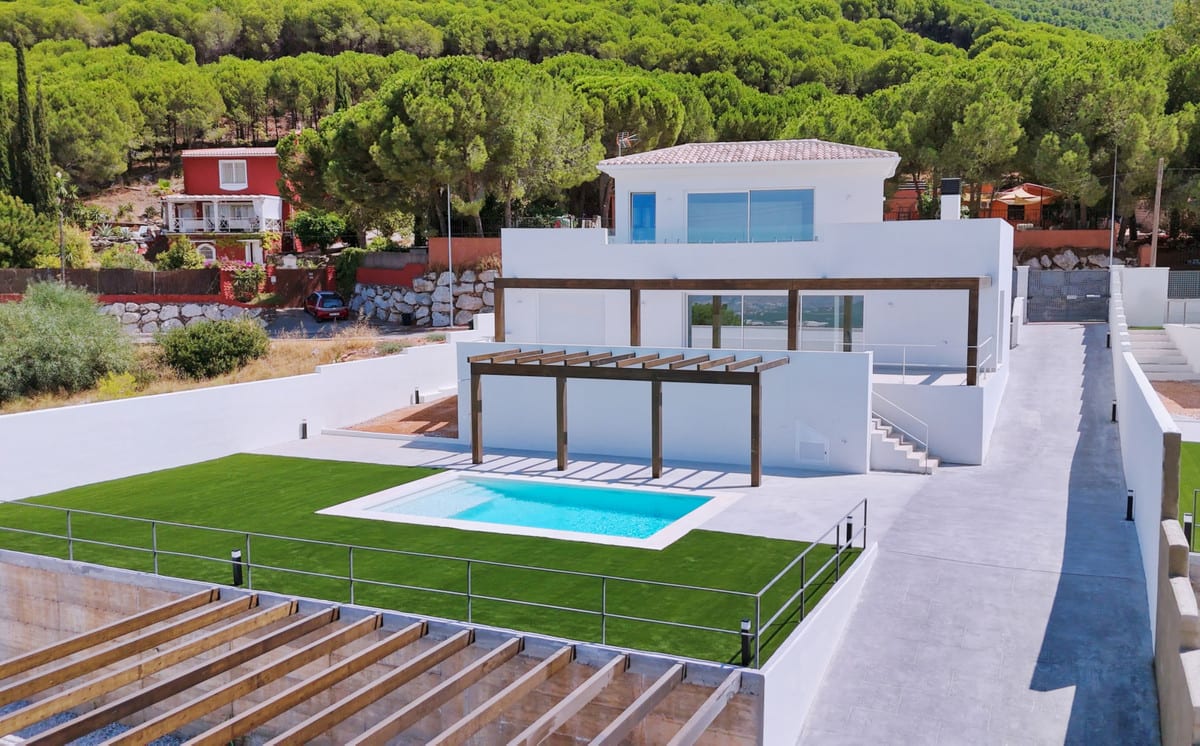 VILLA SANTHAI 3 Y 9 exterior with a white two-storey building, rectangular swimming pool, wooden pergola, green lawn and metal fencing