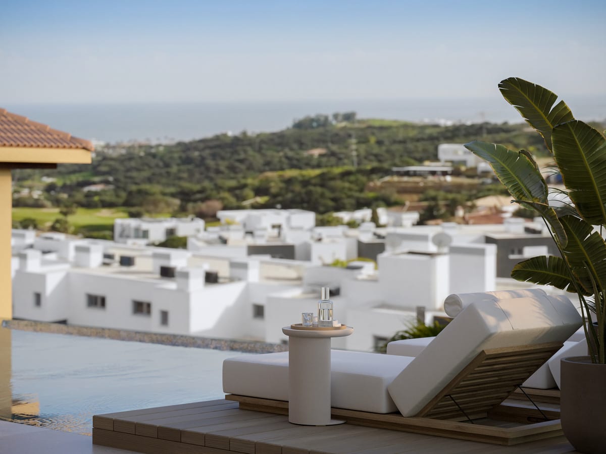 Visualisation of a sun lounger beside the pool with green leaves in the foreground.