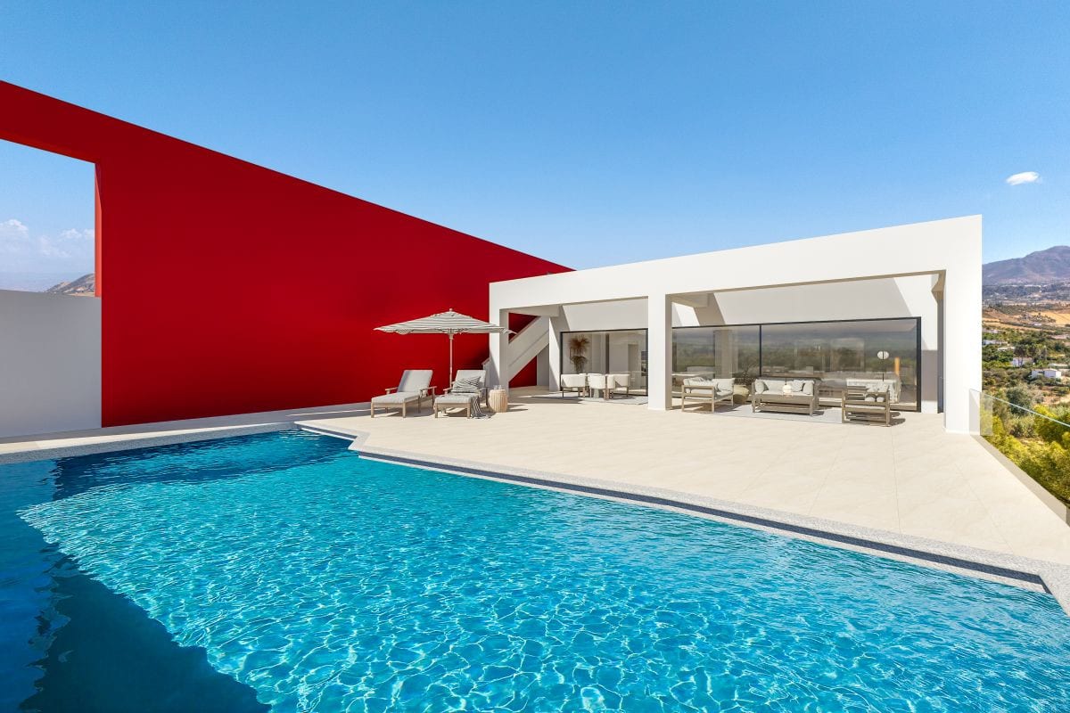 Photorealistic project visualisation of VISTA DEL REY EVIDENT with a blue swimming pool in the foreground, a light terrace with two sun loungers and a striped parasol, an outdoor seating area, a white façade with large glazed sliding doors and a large red feature wall.