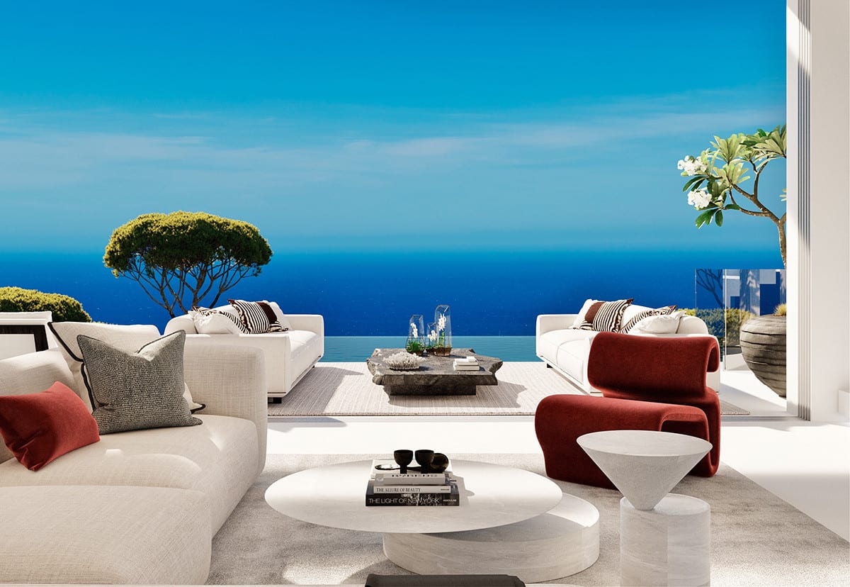 View from the living area of VISTA LAGO RESIDENCES towards the terrace, with cream sofas, a burgundy armchair and the sea beyond the pool edge.