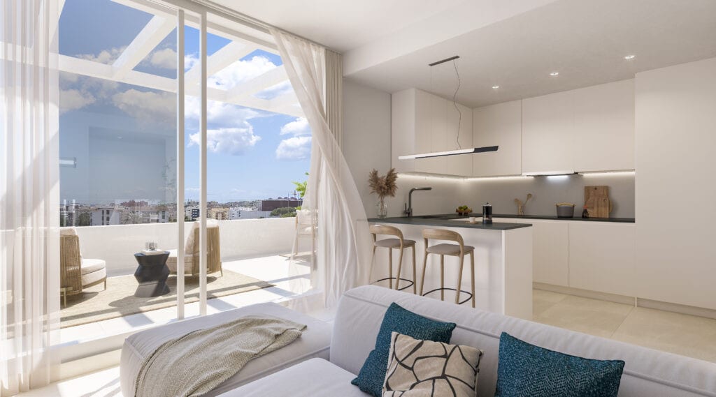 Interior visualisation of ZENITH ESTEPONA with a white kitchen, breakfast bar with bar stools, seating area with blue cushions and a glass sliding door with light curtains leading to the terrace.