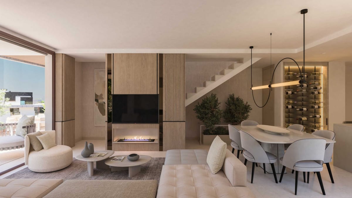 Project visualisation of ZEW ELVIRIA with an open-plan living and dining area, beige sofas, an oval dining table, wall fireplace and wine rack.
