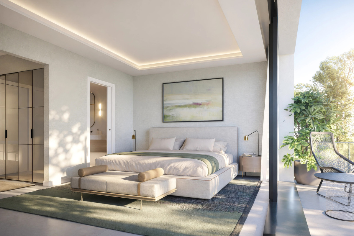 Visualisering af et soveværelse med dobbeltseng, bænk og tæppe, skabe til venstre og store glasskydedøre til højre mod en siddeplads udenfor.