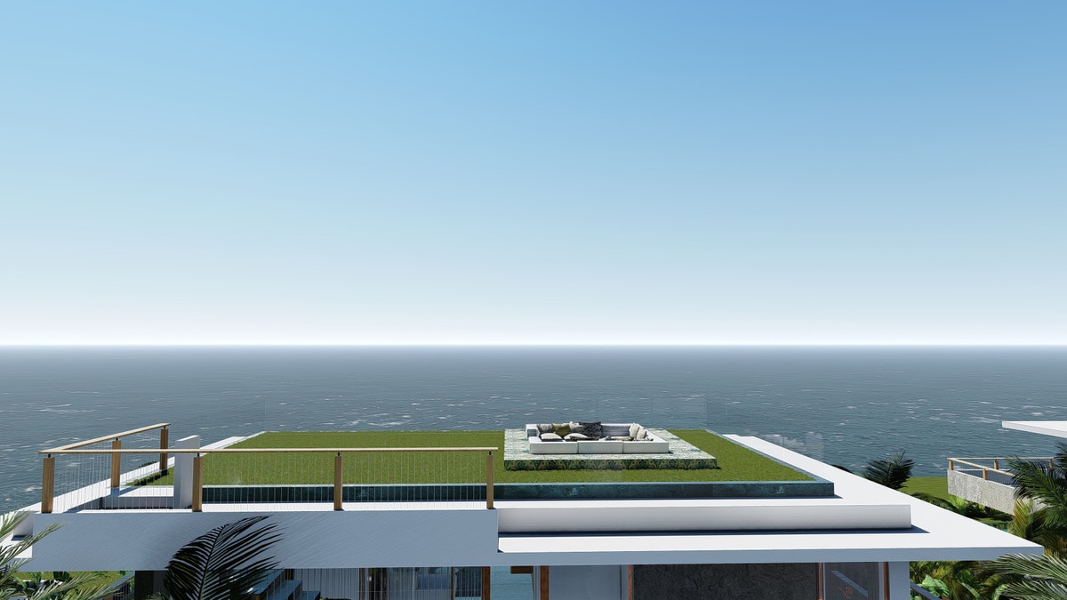 Visualisering af tagterrassen med grøn overflade, nedsænket siddegruppe og lys tagkant; bagved strækker havet sig til horisonten.
