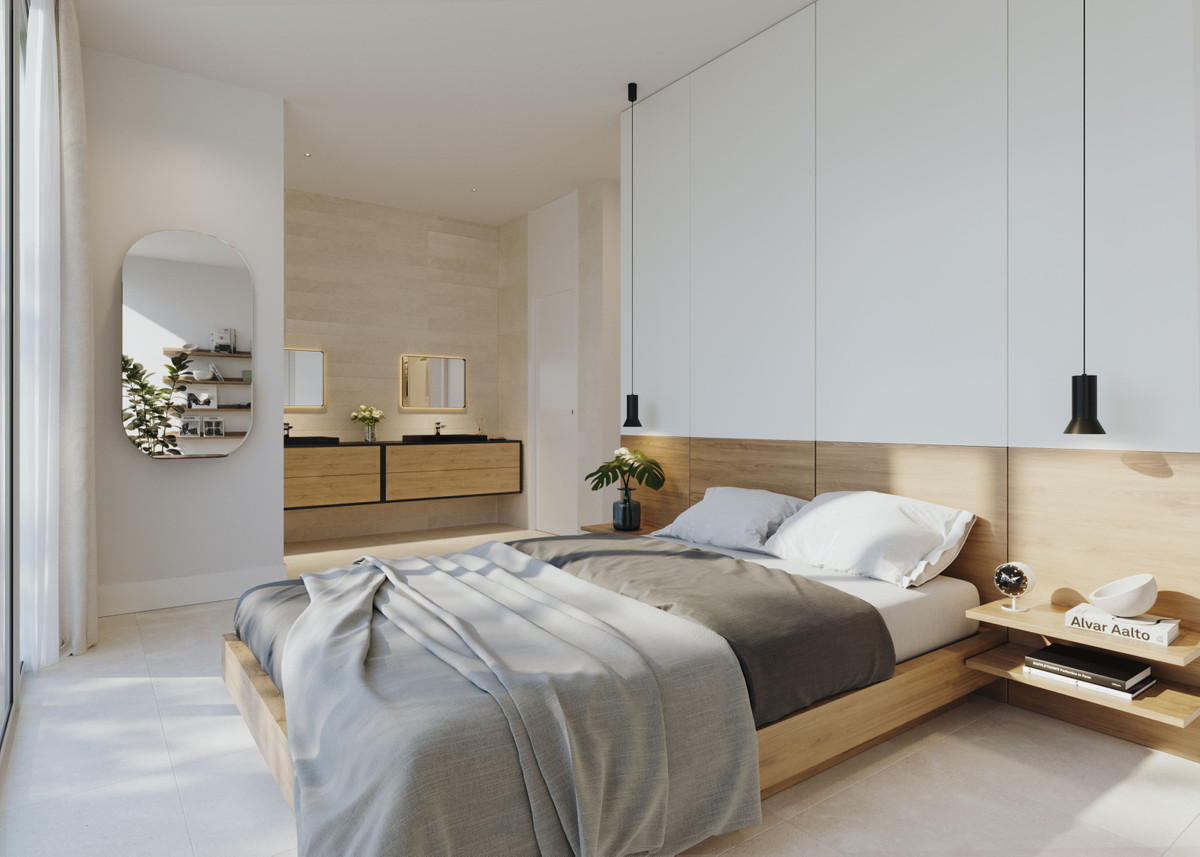 Soveværelsesvisualisering med dobbeltseng og hovedgærde i træ, hvide vægpaneler, pendel og åbning mod et vaskeskab i baggrunden; vist planløsning og materialer er ikke bekræftet for hver villa.